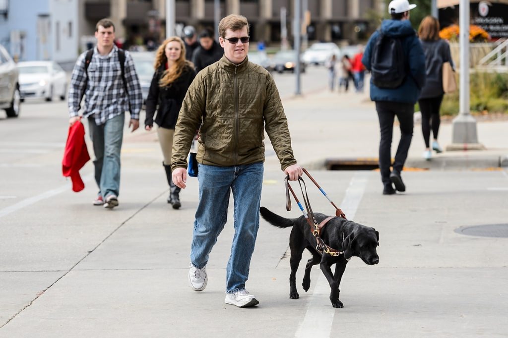 Photo: Drew Hasley and guide dog Shade