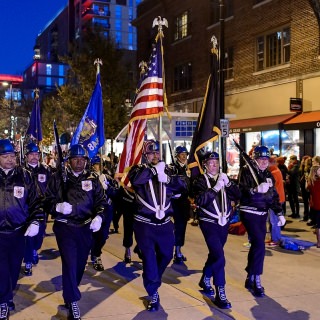 Members of the Wisconsin Veterans of Foreign Wars color guard march down State Street.