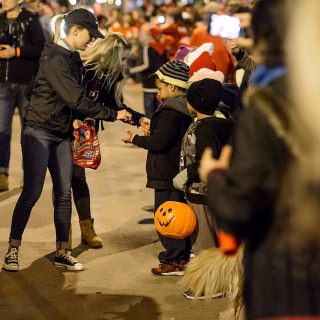 For younger fans, the parade is a chance to restock Halloween candy.