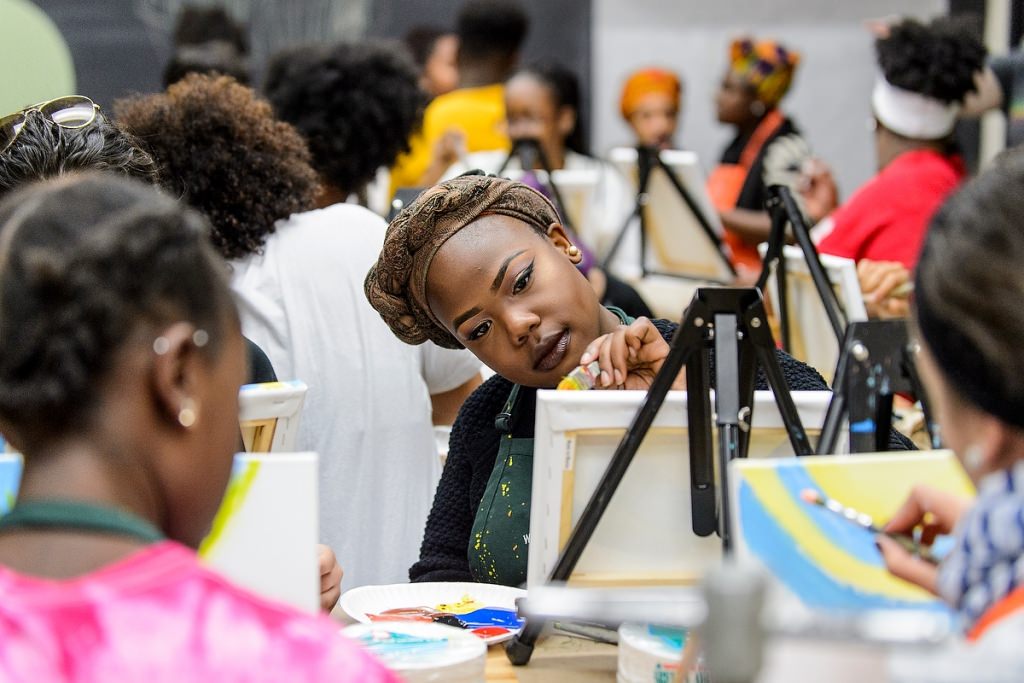 Photo: Students painting on canvases