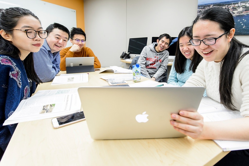 Photo: International students looking at computer