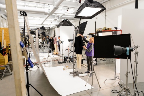 Staff photograph merchandise at an in-house photography studio at Colony Brands, for inclusion in one of the company's catalogs.