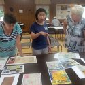 At the Barnes Town Hall. UW-Madison graduate student Catherine Hannula, center, speaks with Tam Larson, of the Barnes Area Historical Association, and a local attendee.