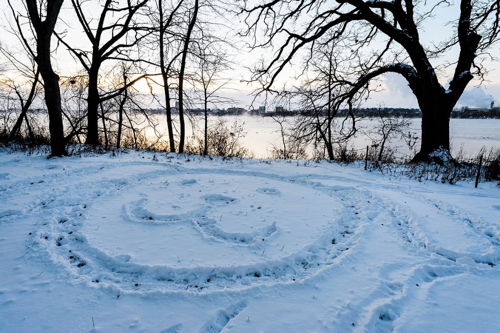 A message in the snow greets early risers along the Picnic Point shoreline on a December morning.