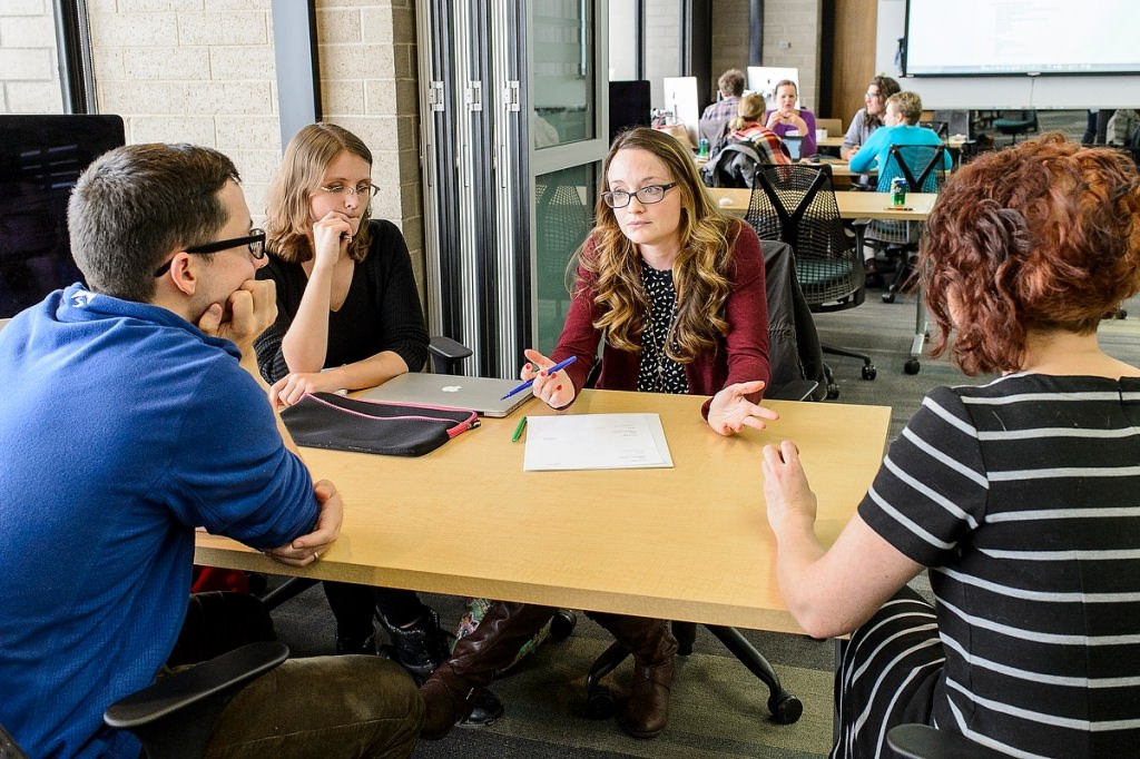 Sarah Springers (center), a science teacher from Middleton, Wisconsin, collaborates with UW-Madison staff and experienced computer-game designers during a Field Day Lab mini-game design workshop held at the Wisconsin Institute for Discovery (WID) at the University of Wisconsin-Madison on Jan. 27, 2017. The educational outreach event is the hosted by the Wisconsin Institute for Discovery's Field Day Lab and focuses on designing and creating educational video games for their students and students across the country. (Photo by Bryce Richter / UW-Madison)