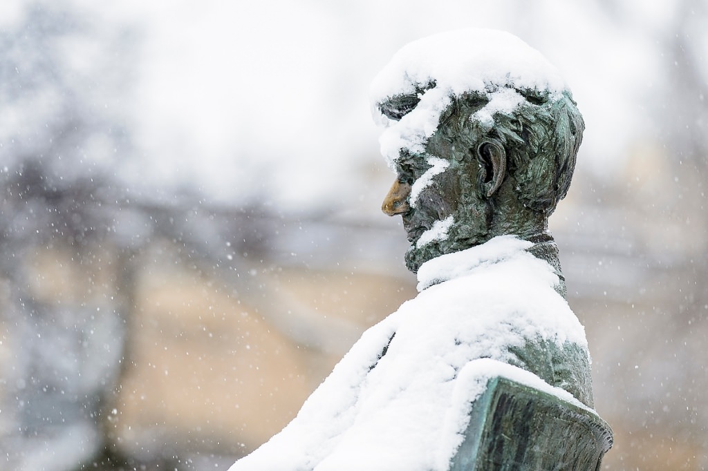 The Abraham Lincoln statue gets a chilly coat of snow.