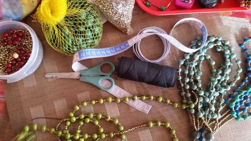 The women in Ecuador use local beads, string and other materials to make their necklaces that are sold in Madison.