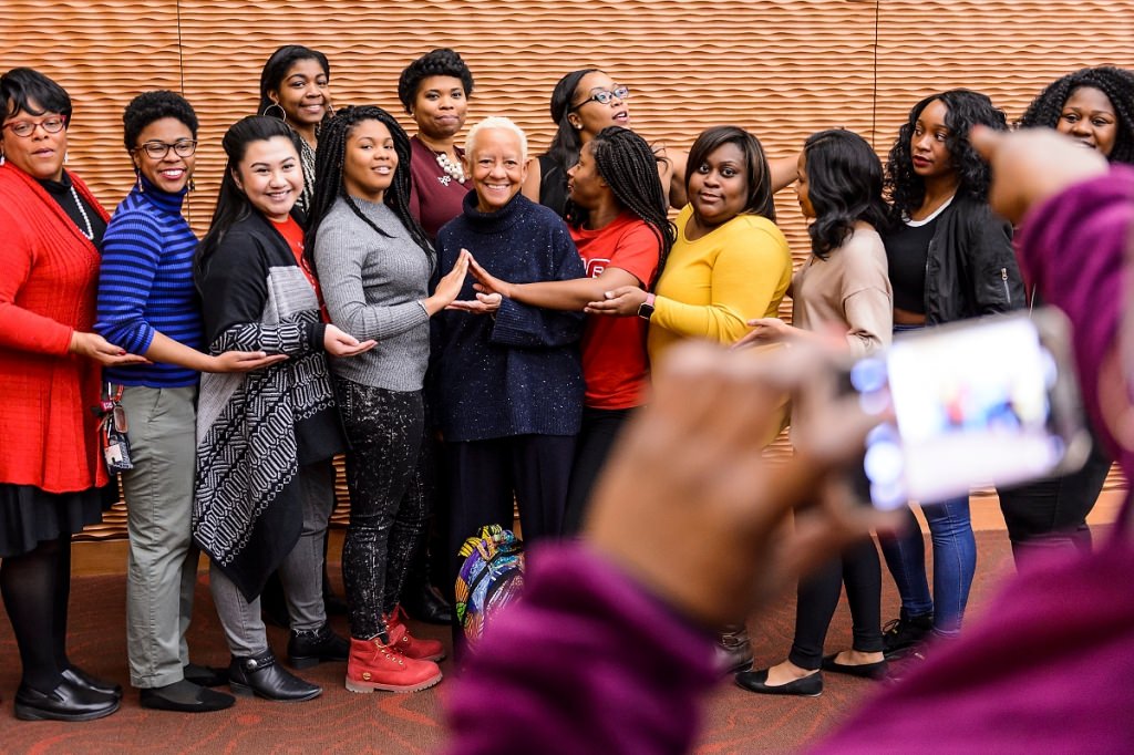 Giovanni poses with sisters of Delta Sigma Theta Sorority during a meet-and-greet session with UW-Madison students and guests.