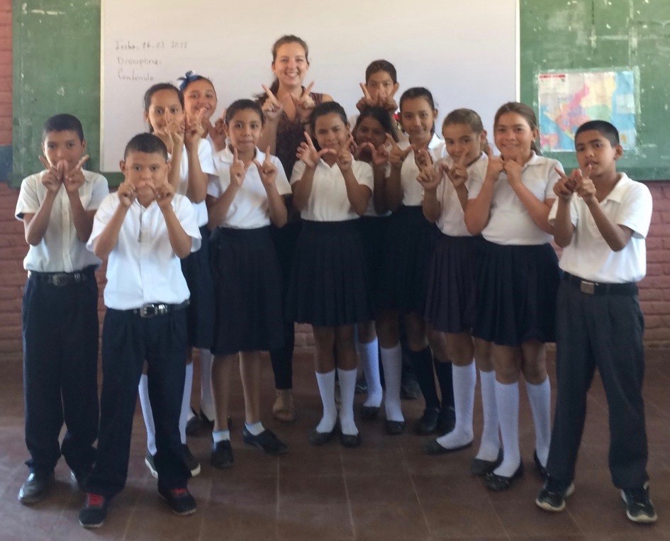 As an environment volunteer for the Peace Corps in Nicaragua, Laura Linde, center rear, teaches science in elementary schools, facilitates gender-focused camps, and is involved in Peace Corps Nicaragua’s gender and development committee. 