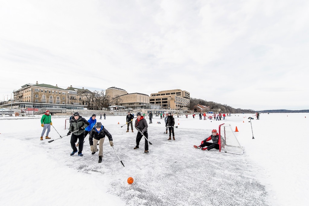 Dozens of students take part in a broomball tournament hosted by Rec Sports.