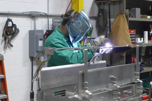 Photo: Worker welding a sub-assembly