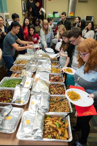 ILC students feast during a traditional Lunar New Year celebration. 