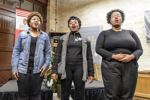 Nikeya Bramlett, Deja Mason and Bobbie Briggs, members of the University Gospel Choir, perform before a crowd of over 100 people during a dedication and libation ceremony for the new Black Cultural Center.