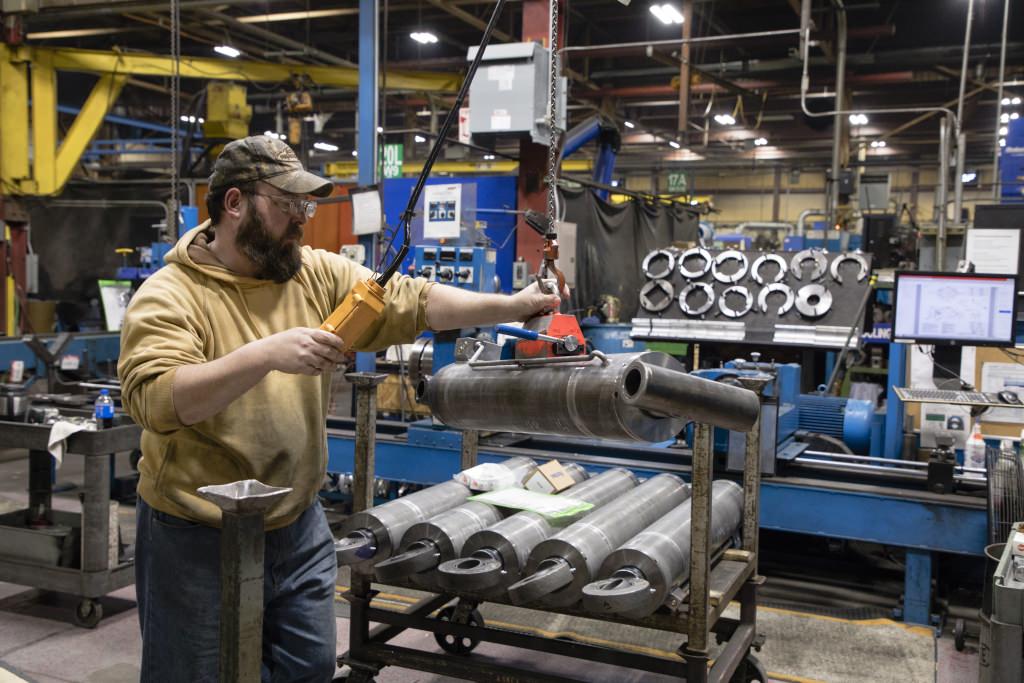 Jessie Smith puts the finishing touches on some hydraulic cylinders at JARP Industries in Wausau.