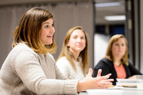 Author Erin Celello, left, talks during a discussion session held by the Warrior Book Club. The book being discussed during this session was Learning to Stay, by Celello. 