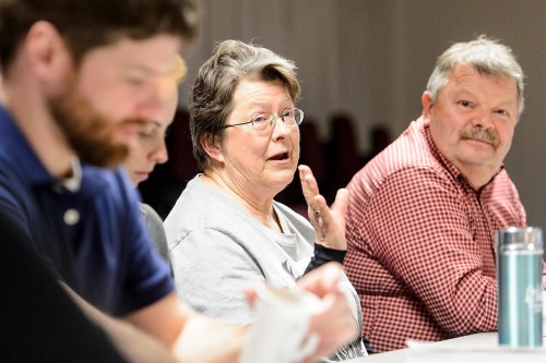 Cheryl Adams (center), a U.S. Navy veteran, talks during a discussion session held by the Warrior Book Club at the Wisconsin Veterans Museum.