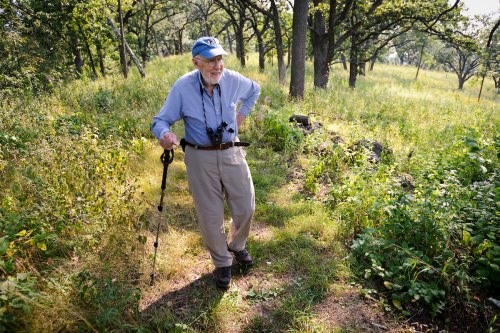 In 2013, Tom Brock walks in 140 acres of restored prairie, oak savannah and woodlands that he and his wife established as the Pleasant Valley Conservancy in Black Earth, Wisconsin.