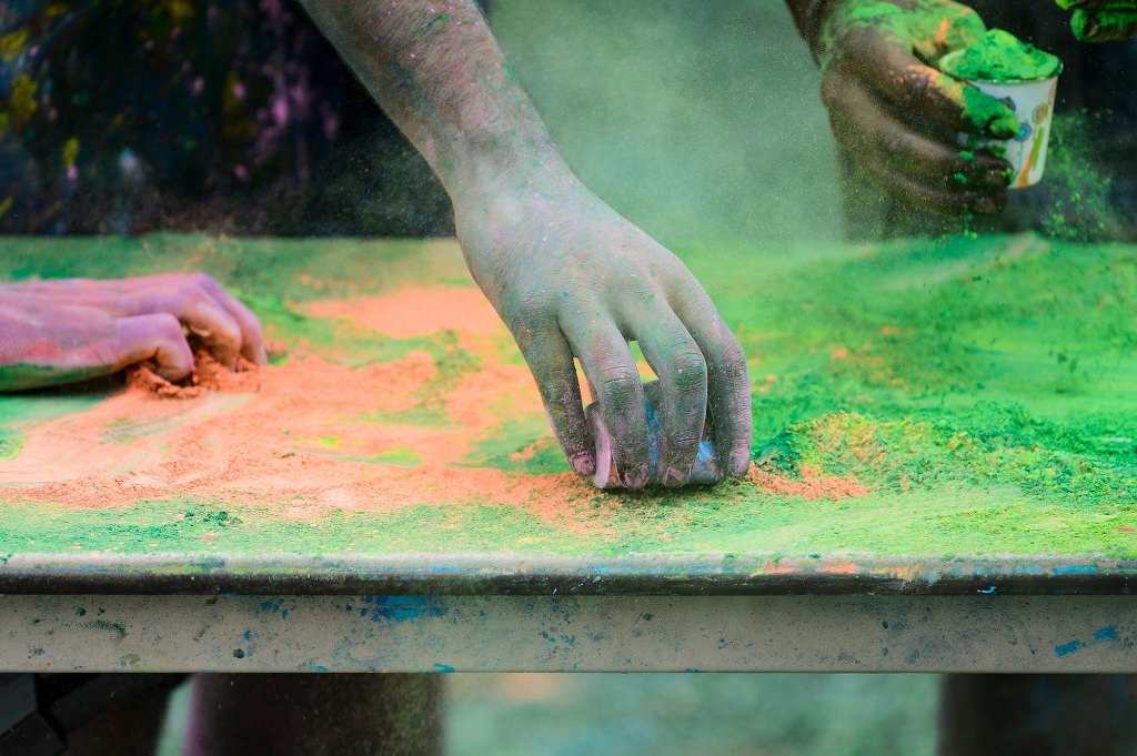 Hundreds of students participate in the spirited Hindu tradition of throwing colored powder during Rang de Madison, a Holi festival of color hosted by the Madison Hindu Students Association outside of Dejope Residence Hall at the University of Wisconsin-Madison on April 15, 2017. The event, which celebrates the arrival of spring and victory of good over evil, was held in collaboration with UW-Madison's India Students Association and Indian Graduate Students Association. (Photo by Jeff Miller/UW-Madison)