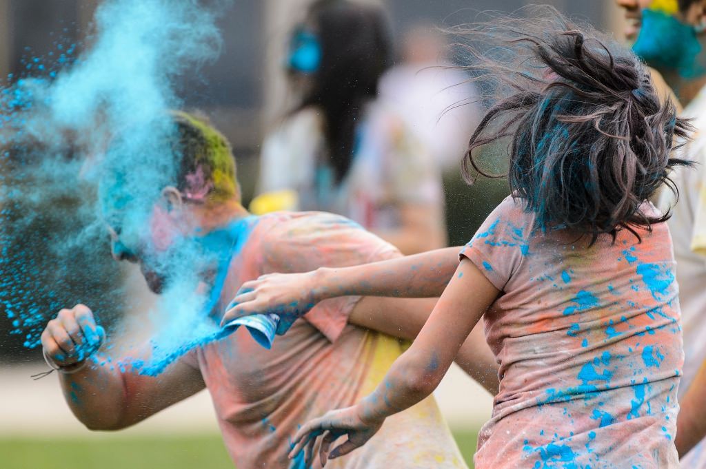 Hundreds of students participate in the spirited Hindu tradition of throwing colored powder during Rang de Madison, a Holi festival of color hosted by the Madison Hindu Students Association outside of Dejope Residence Hall at the University of Wisconsin-Madison on April 15, 2017. The event, which celebrates the arrival of spring and victory of good over evil, was held in collaboration with UW-Madison's India Students Association and Indian Graduate Students Association. (Photo by Jeff Miller/UW-Madison)