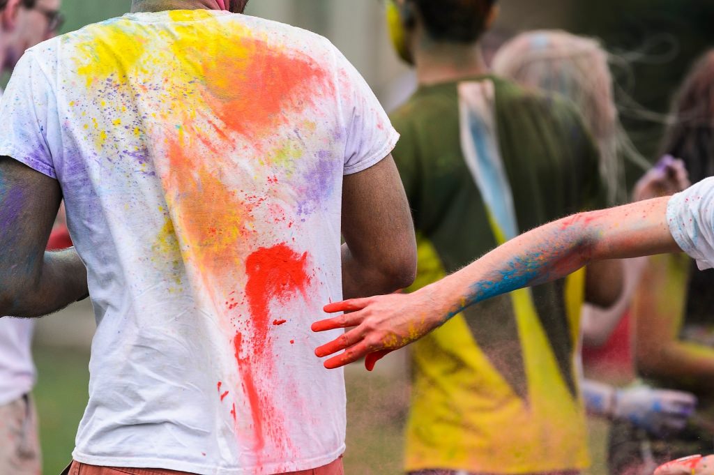 Hundreds of students participate in the spirited Hindu tradition of throwing colored powder during Rang de Madison, a Holi festival of color hosted by the Madison Hindu Students Association outside of Dejope Residence Hall at the University of Wisconsin-Madison on April 15, 2017. The event, which celebrates the arrival of spring and victory of good over evil, was held in collaboration with UW-Madison's India Students Association and Indian Graduate Students Association. (Photo by Jeff Miller/UW-Madison)