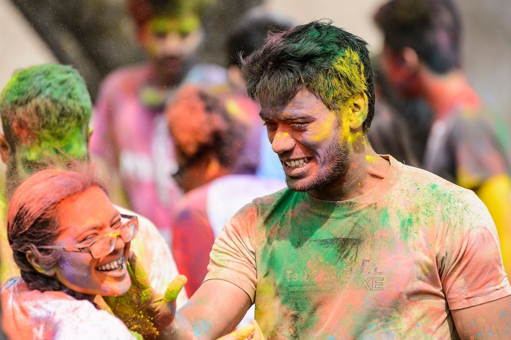 Hundreds of students participate in the spirited Hindu tradition of throwing colored powder during Rang de Madison, a Holi festival of color hosted by the Madison Hindu Students Association outside of Dejope Residence Hall at the University of Wisconsin-Madison on April 15, 2017. The event, which celebrates the arrival of spring and victory of good over evil, was held in collaboration with UW-Madison's India Students Association and Indian Graduate Students Association. (Photo by Jeff Miller/UW-Madison)