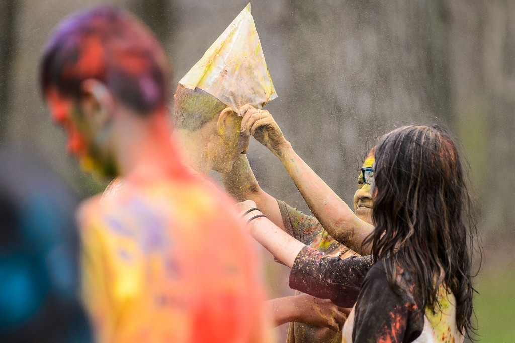 Hundreds of students participate in the spirited Hindu tradition of throwing colored powder during Rang de Madison, a Holi festival of color hosted by the Madison Hindu Students Association outside of Dejope Residence Hall at the University of Wisconsin-Madison on April 15, 2017. The event, which celebrates the arrival of spring and victory of good over evil, was held in collaboration with UW-Madison's India Students Association and Indian Graduate Students Association. (Photo by Jeff Miller/UW-Madison)