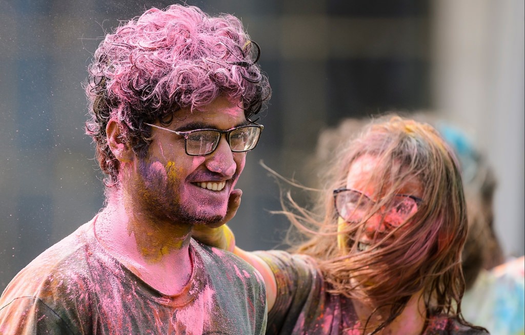 Hundreds of students participate in the spirited Hindu tradition of throwing colored powder during Rang de Madison, a Holi festival of color hosted by the Madison Hindu Students Association outside of Dejope Residence Hall at the University of Wisconsin-Madison on April 15, 2017. The event, which celebrates the arrival of spring and victory of good over evil, was held in collaboration with UW-Madison's India Students Association and Indian Graduate Students Association. (Photo by Jeff Miller/UW-Madison)