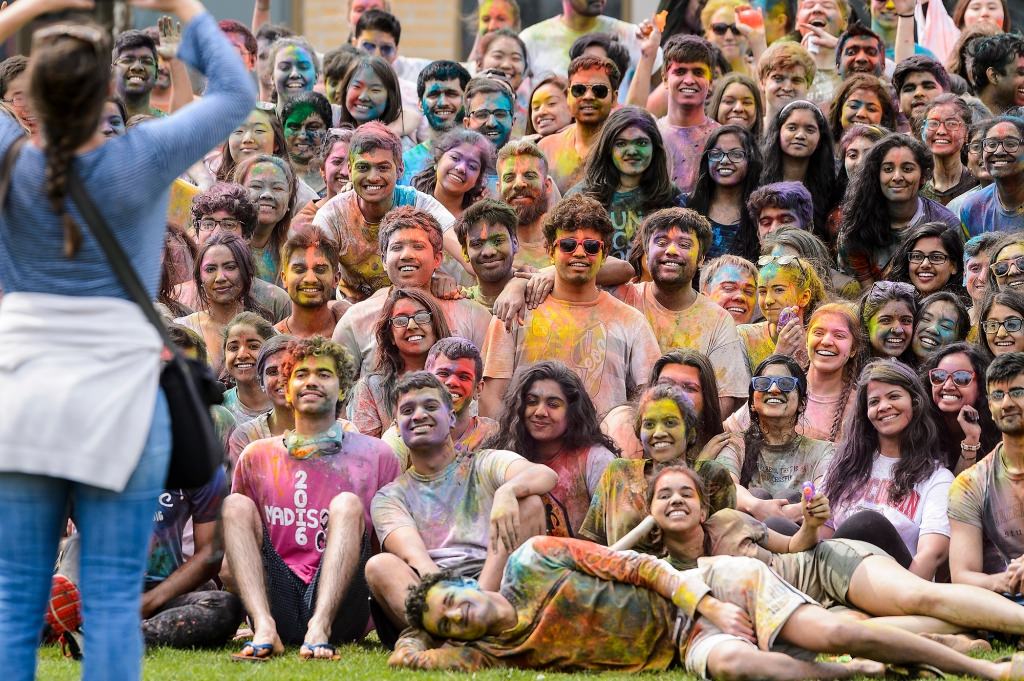 Hundreds of students participate in the spirited Hindu tradition of throwing colored powder during Rang de Madison, a Holi festival of color hosted by the Madison Hindu Students Association outside of Dejope Residence Hall at the University of Wisconsin-Madison on April 15, 2017. The event, which celebrates the arrival of spring and victory of good over evil, was held in collaboration with UW-Madison's India Students Association and Indian Graduate Students Association. (Photo by Jeff Miller/UW-Madison)