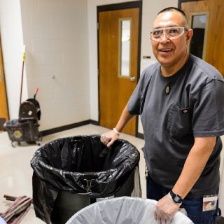 Jorge Ramos Garcia, a second-shift custodian with Physical Plant Services, collects trash while cleaning labs and offices at the Veterinary Medicine at the University of Wisconsin-Madison on April 11, 2017. Garcia is one of eight recipients of a 2017 University Staff Recognition Award (USRA). (Photo by Jeff Miller/UW-Madison)