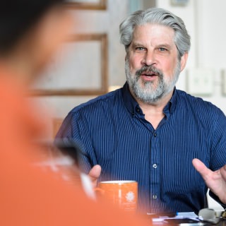 On March 23, 2017, Steven Pomplum, director of external relations in the Nelson Institute for Environmental Studies, meets in Science Hall at the University of Wisconsin-Madison with a postdoctoral student working on a documentary movie and community-outreach project involving the importance of quality food to disenfranchised residents living in South Madison. Pomplun is one of eight recipients of a 2017 Academic Staff Excellence Award (ASEA). (Photo by Jeff Miller/UW-Madison)