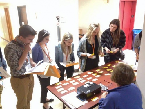 Students do a poverty simulation as part of the Wisconsin Express program, helping illustrate some of the difficult choices people in poverty face.