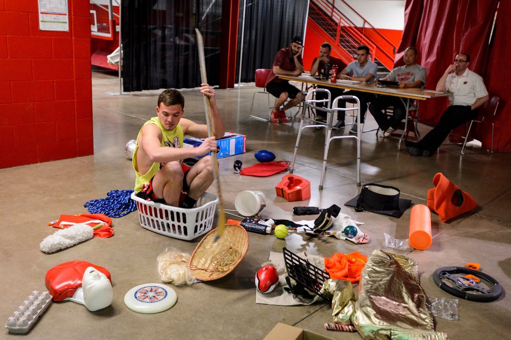 First-year student Tanner Pettit improvises with a variety of props before a panel of judges during preliminary tryouts for one of seven positions on the 2017-2018 Bucky Badger mascot team. The event was held at the Field House at the University of Wisconsin-Madison on April 17, 2017. Pettit ultimately made the team. (Photo by Jeff Miller/UW-Madison)