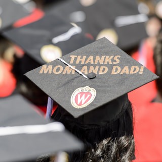 Graduates display personal messages on their graduation caps during UW-Madison's spring commencement ceremony at Camp Randall Stadium at the University of Wisconsin-Madison on May 13, 2017. The outdoor graduation is expected to be attended by more than 6,000 bachelor's and master's degree candidates, and their guests. (Photo by Bryce Richter / UW-Madison)