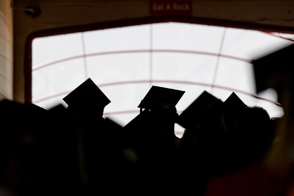 Soon-to-be graduates walk into the tunnel of Camp Randall Stadium at the University of Wisconsin–Madison before the start of UW–Madison's spring commencement ceremony at Camp Randall Stadium on May 13, 2017. The outdoor graduation is expected to be attended by more than 6,000 bachelor's and master's degree candidates, and their guests. (Photo by Jeff Miller/UW-Madison)