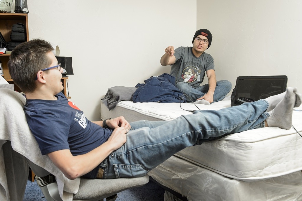 Michael Williams (left), student at Seymour Community High School in Seymour, WI, talks with his best friend Chris Gourd (right) in his home on the Oneida Indian Reservation on May 8, 2017. Both Williams and Gourd are participants in the Tribal Technology Institute outreach program created by the Division of Information Technology (DoIT) at the University of Wisconsin–Madison, which is designed as a college pipeline program for members of the Oneida Nation and Lac du Flambeau tribal communities in northern Wisconsin. In the program, students learn computer coding, website design and multimedia skills while working with mentors and completing internships. Additionally, the students also spend at the UW–Madison campus. (Photo by Bryce Richter / UW–Madison)