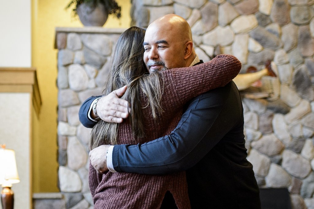 Kenadi Mayo (left), student at Lakeland Union High School in Woodruff, WI and member of the Chippewa tribal community, hugs Chris Kilgour (right), program manager of the UW Tribal Technology Institute (TTI) on May 1, 2017. Mayo is a participant in the TTI outreach program created by the Division of Information Technology (DoIT) at the University of Wisconsin–Madison, which is designed as a college pipeline program for members of the Oneida Nation and Lac du Flambeau tribal communities in northern Wisconsin. In the program, students learn computer coding, website design and multimedia skills while working with mentors and completing internships. Additionally, the students spend time at the UW–Madison campus. (Photo by Bryce Richter / UW–Madison)