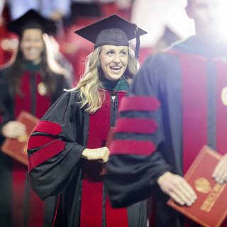 Graduates walk with their diploma cases during UW-Madison's spring commencement ceremony at the Kohl Center at the University of Wisconsin-Madison on May 12, 2017. The indoor graduation was attended by approximately 830 doctoral, MFA and medical student degree candidates, plus their guests. (Photo by Bryce Richter / UW-Madison)