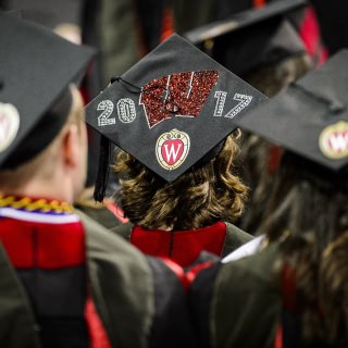 A graduate displays a decorated graduation cap during UW-Madison's spring commencement ceremony at the Kohl Center at the University of Wisconsin-Madison on May 12, 2017. The indoor graduation was attended by approximately 830 doctoral, MFA and medical student degree candidates, plus their guests. (Photo by Bryce Richter / UW-Madison)