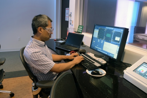 An engineer at work in GE Healthcare's Waukesha headquarters. The company maintains dozens of instruments in test bays that resemble the normal clinical installation. Customers visit on some days; on others, engineers refine and troubleshoot software. 