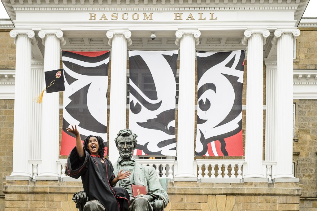 Latifa Barti lets her mortarboard fly.