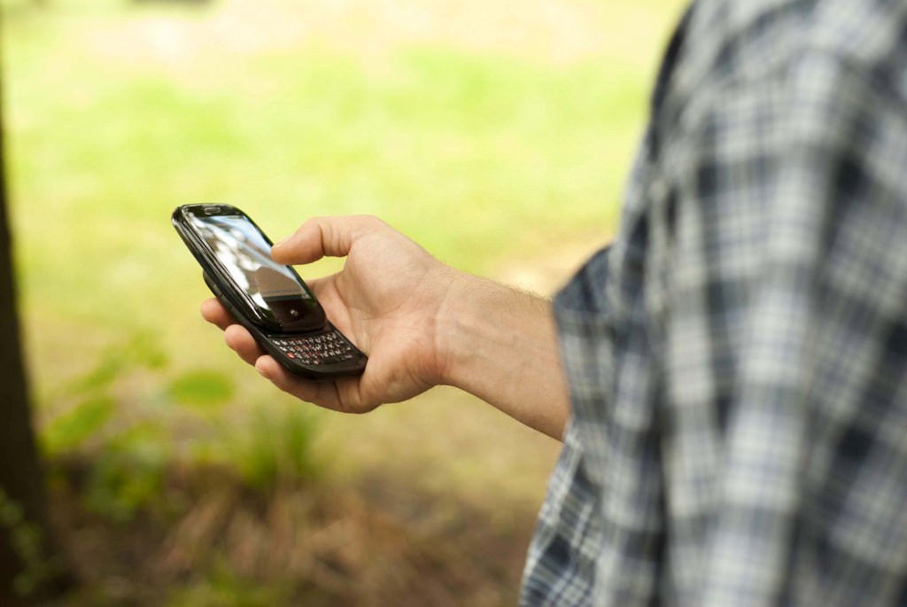 A-CHESS study participant uses the mobile phone application. 