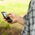 A-CHESS study participant uses the mobile phone application. 