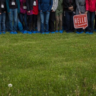 Seminar participants donned blue boot covers to tour the Kelley Dairy Farm in Fond du Lac.