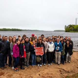 The group gathered at the Wisconsin River after learning about how stewardship of the river has evolved over the years.