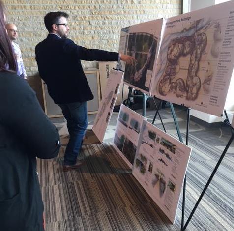 People examine the plans for Monona created by UW–Madison students as part of UniverCity Year May 3 at DeJope Hall.