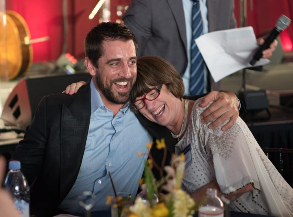 Aaron Rodgers and Susan North share a hug.