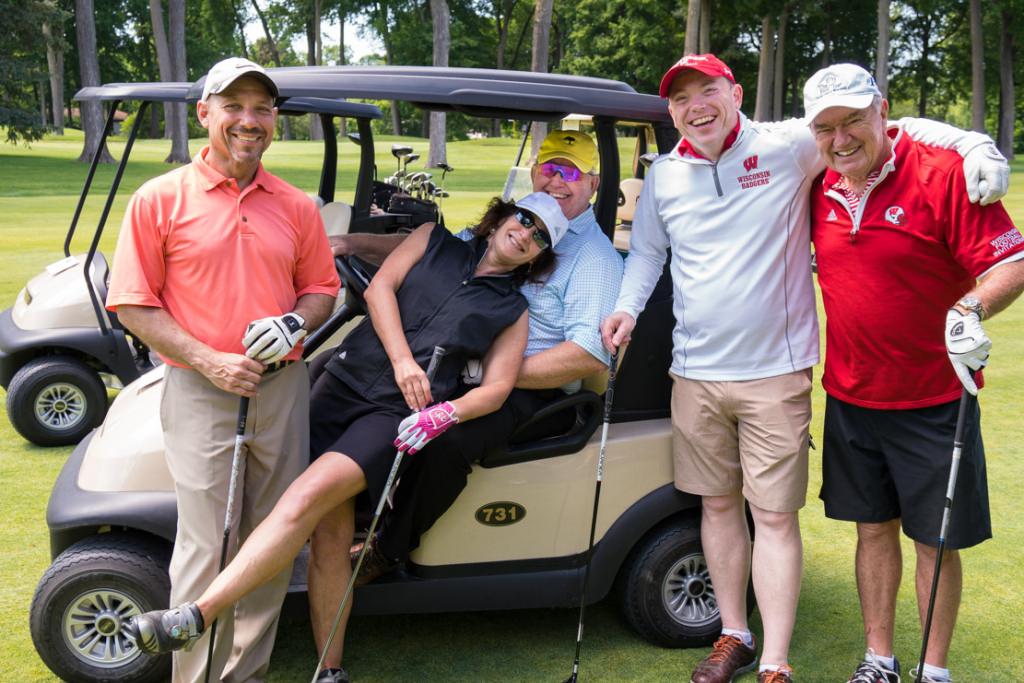 Badger women's basketball coach Jonathan Tsipis, second from right, and friends enjoying themselves.