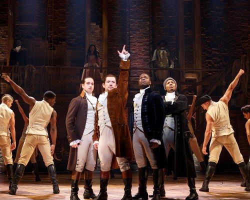 Photo: "Hamilton" cast members in costume on stage