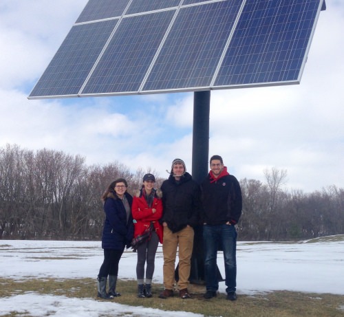 Students from capstone class pose with a solar panel outside the Waterloo, Wisconsin utilities building: from left: Lisa Walsh, Bailey Zak, Jim Costello-Mikecz and Alex Bristol. Not pictured was James Zavoral. 