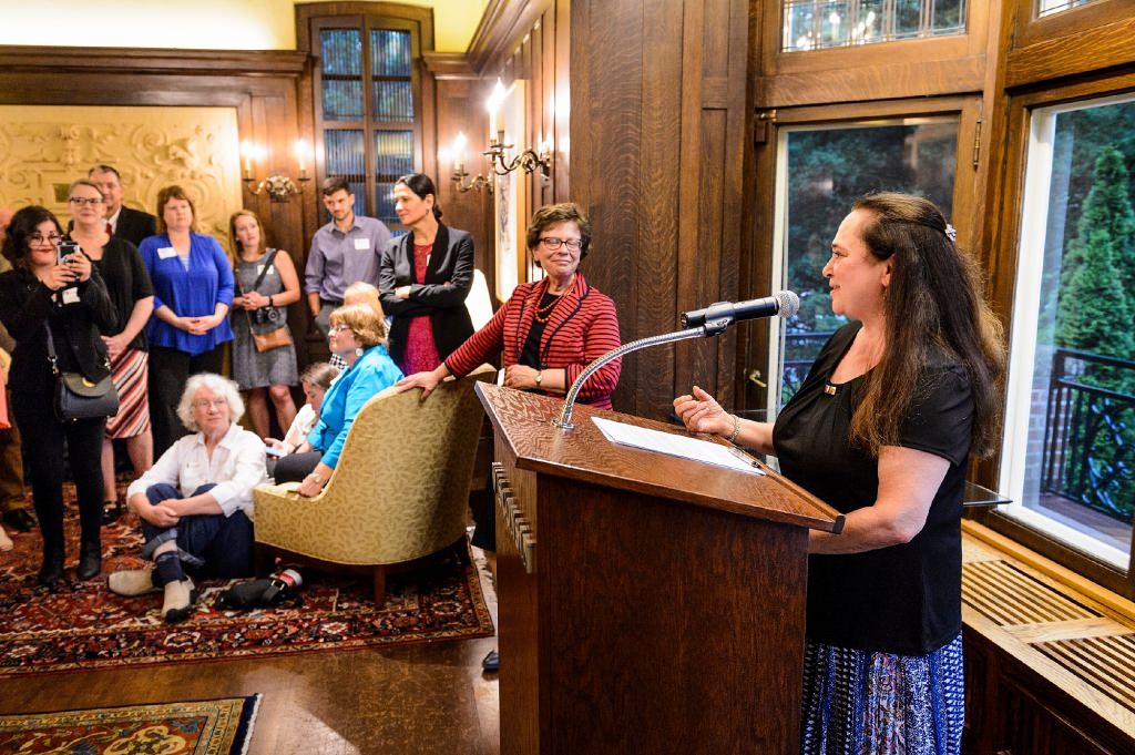 Emily Auerbach, professor of English at UW-Madison, receives the 2017 LaMarr Billups Community-University Engagement Award during a 2017 Community-University Partnership Award event at Olin House, the Chancellor's residence at the University of Wisconsin-Madison on June 28, 2017. Presenting the awards are UW-Madison Chancellor Rebecca Blank and Leslie Orrantia, UW-Madison director of community relations. (Photo by Jeff Miller / UW-Madison)